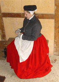 Gen dressing in doublet and petticoat in the Cape Merchant's office