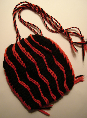 Pink and black striped sprang wool bag